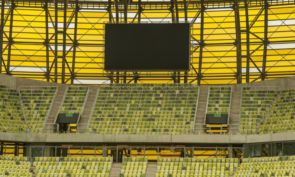 How do LED screens use statistics to enhance the stadium experience?