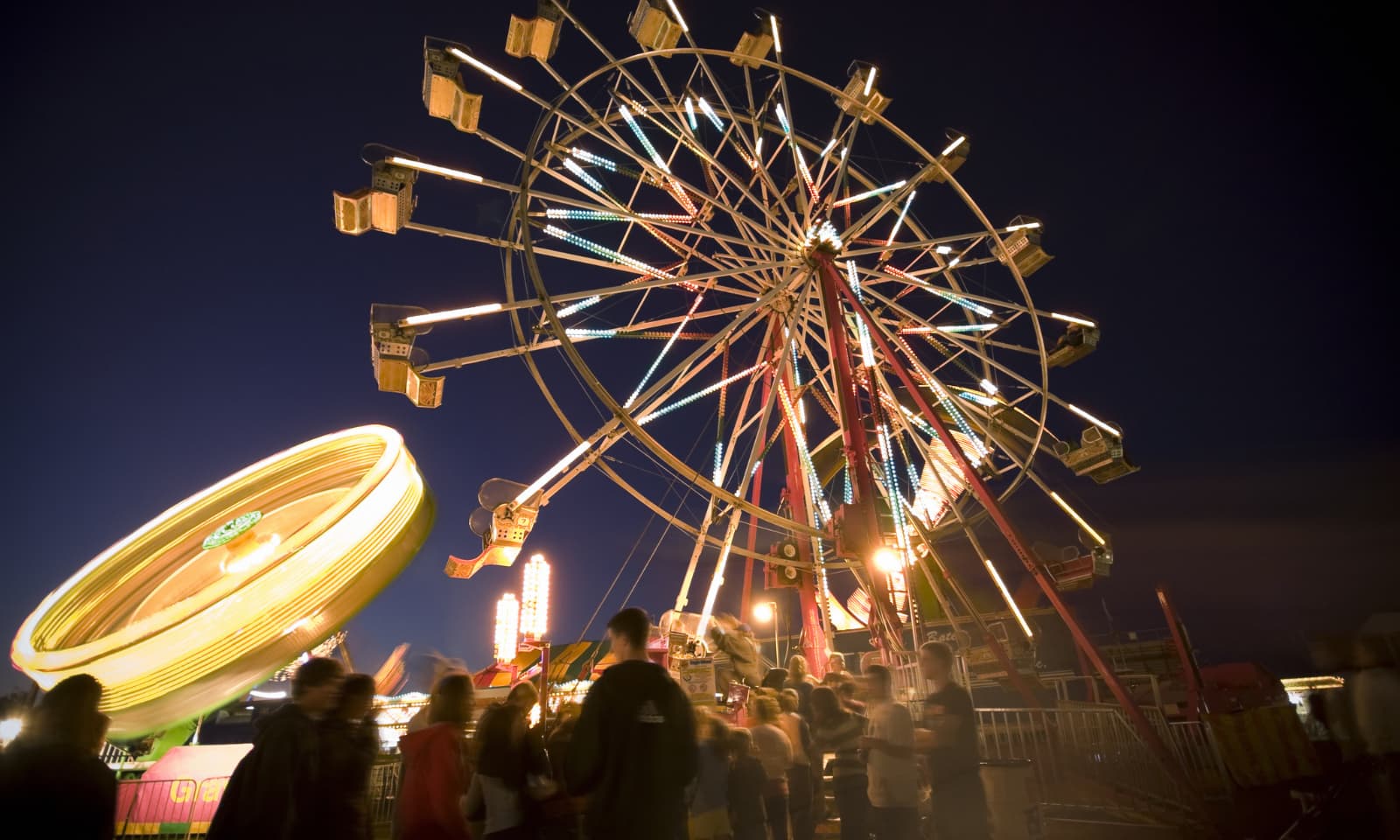 people waiting in queue for ferris wheel