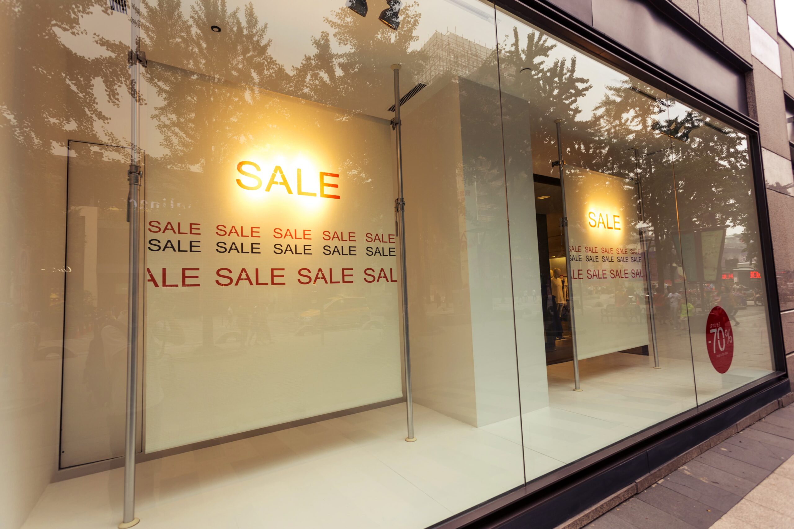 big sale sign outside a shop window